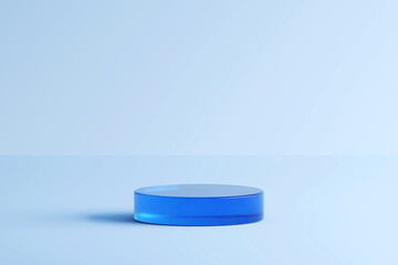 A blue cylinder display platform against a light blue backdrop. It creates a visually appealing setting for product placement or design presentations