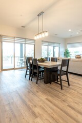 In the center of the room, you can see a dining table and chairs