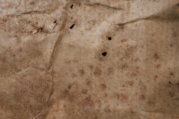 Old paper crack grunge. Vintage paper texture with dust and scratches crumpled.