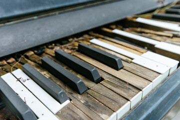 Abandoned piano keys urban setting still life weathered environment close-up artistic concept
