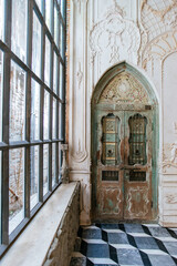 Intricate vintage wooden doors with decorative patterns elegant interior architectural photography cozy atmosphere close-up view