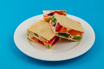 Colorful jelly waffle cakes with fresh fruit