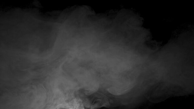 Soft fog haze on dark background. Realistic atmospheric gray smoke on black background. . High quality 4k footage