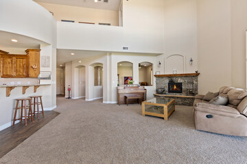 A cozy living room featuring a beautiful fireplace and a comfy couch