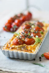 ppetizing chicken and tomato quiche with melted cheese on a flaky crust. Perfect for food blogs, recipes, and ads. Top view, close-up, and sliced shots. Natural lighting, rustic style, selective focus