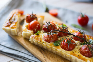 ppetizing chicken and tomato quiche with melted cheese on a flaky crust. Perfect for food blogs, recipes, and ads. Top view, close-up, and sliced shots. Natural lighting, rustic style, selective focus