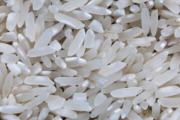 Close-Up of White Rice Grains. Detailed Close-Up of Raw White Rice. Uncooked Rice Grain Texture