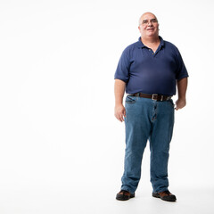 The Handyman. Full length portrait of a friendly faced man dressed casually set against a white studio backdrop.