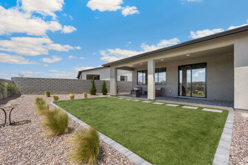 Fototapeta premium An attractive house featuring a spacious lawn area right in front of it