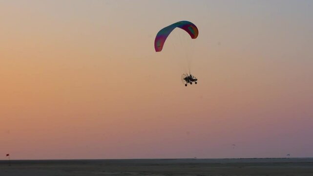 Tourists Enjoying Parasailing at Sunset in Rann of Kutch, Gujarat, India
