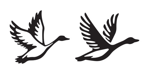 Set of flying goose bird silhouettes isolated on white background © nurartvi