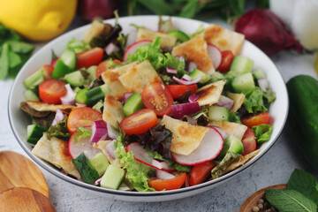 A bowl with Fattoush - Traditional Levantine salad