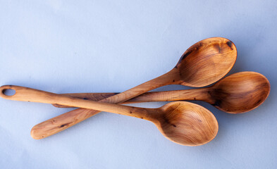 Wooden kitchen utensils stacked view close up