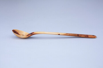 Wooden kitchen utensils stacked view close up