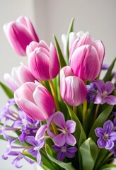 Obraz premium Pastel purple tulips and violets in a whimsical spring bouquet, purple flowers, soft, purple