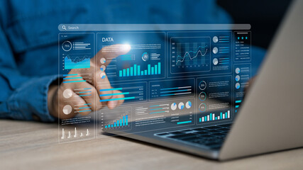 Data analysis concept, businessman using laptop to analyze business data and information management...
