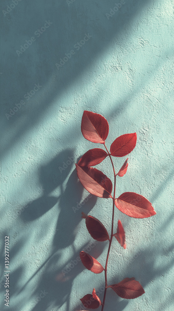 Poster red leaves branch on teal textured background, casting shadows sunlight illuminates scene creating m