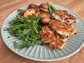 Vegiterian food with potatoes beans and lettuce 