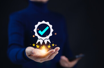 Certified Quality Assurance and Certification Compliance Concept. A person holds a glowing...
