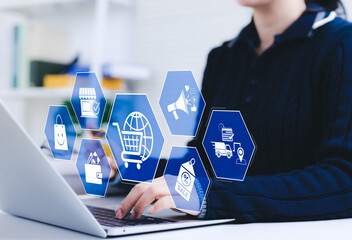 Online shopping and e-commerce concept. A woman using laptop with ecommerce icons, shopping cart, discount tag, and delivery truck, represent online shopping, internet retail, digital marketing, shop,