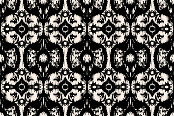 Ikat paisley embroidery on the fabric in Indonesia, India and Asian countries.geometric ethnic oriental seamless pattern.Aztec style. Illustration. Design for texture, fabric,clothing,wrapping,carpet.