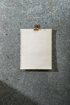 Blank torn out vintage graph paper on magnet board
