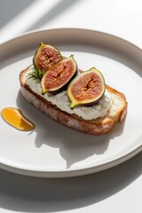 Slice of toast topped with creamy ricotta, fresh figs, honey drizzle, minimalistic presentation
