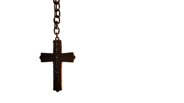 Symbolic cross hanging near a cozy fire in a spiritual setting