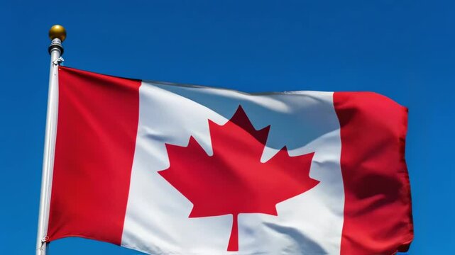 Canadian Flag Waving in Blue Sky