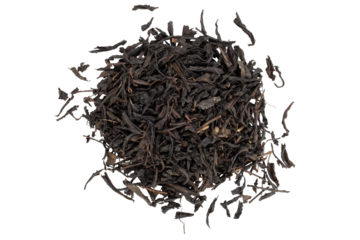 Close-up of a pile of black tea leaves. Isolation on transparent background.