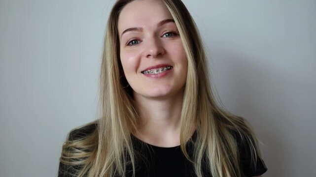 A girl with braces. Visit to the dentist. Beautiful smile