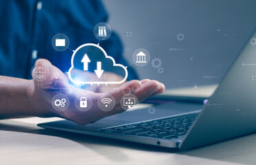 Man hand holding virtual cloud icon on laptop screen. Big data storage or management concept. Digital network connection. Cloud computing platform technology. Computer resources for backup