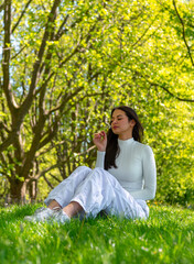 Gen Z woman enjoying the spring nature in a public park in Stuttgart, Germany