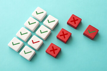 Obraz premium incomplete. completion. issue – Red and White Blocks, Green Check Marks, Red X Symbols on Turquoise Flat Lay Background for Assessment, Voting, and Business Concept Design