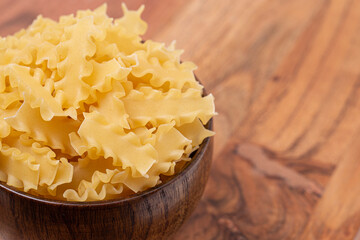 A Bowl of Raw and Dry Mini Lasagna Noodles