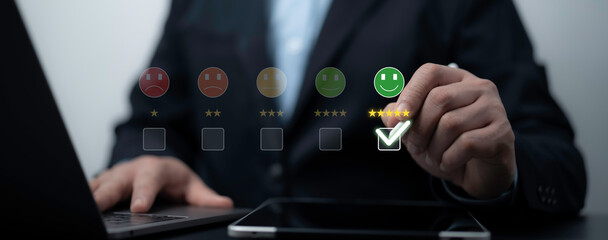 Hand choosing five star rating on digital interface representing excellent customer satisfaction and positive service evaluation in business context