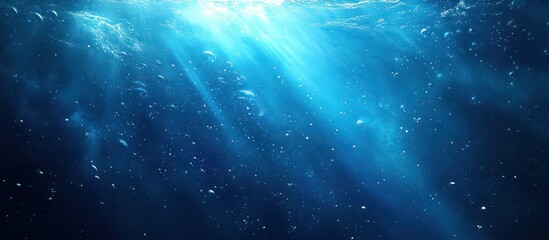 Underwater sunlight beams, ocean bubbles, deep blue background, nature backdrop