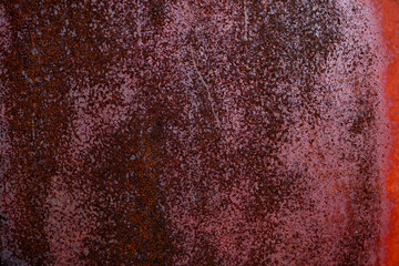 Very old red metal door with rusty texture
