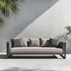 Modern outdoor sofa with cushions against a minimalist wall  