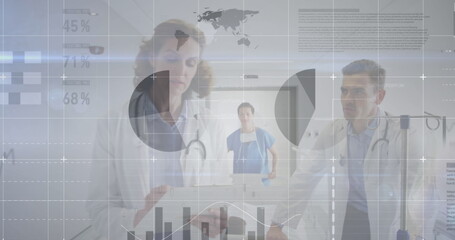 Statistical data processing against male and female doctor discussing at hospital