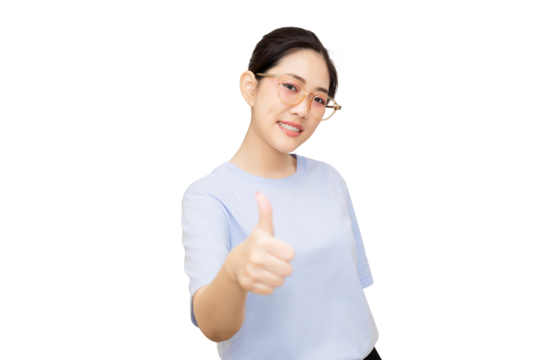 A smiling woman in a light blue shirt gives a thumbs-up, expressing positivity and confidence.