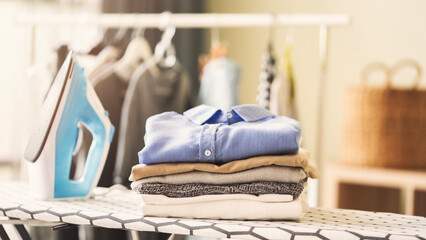 Ironing clothes on ironing board