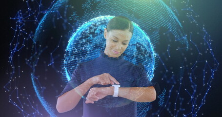 Image of globe with networks of connections over businesswoman using smartwatch