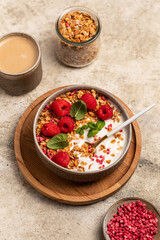 yogurt with granola and raspberries, breakfast