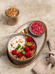 yogurt with granola and raspberries, breakfast