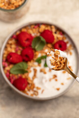 yogurt with granola and raspberries, breakfast
