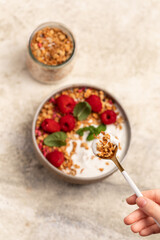 yogurt with granola and raspberries, breakfast