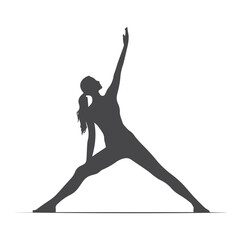 Fototapeta premium A clean, simple silhouette of a woman performing the yoga triangle pose.