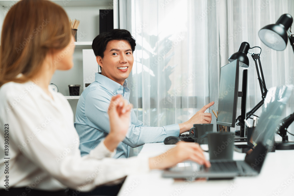 Poster smiling asian man talking with woman colleague in planning marketing report project on laptop casual