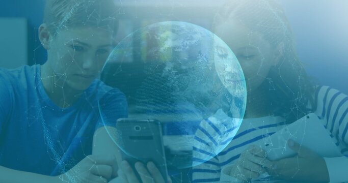 Image of network of connections and globe over school children using smartphone in background